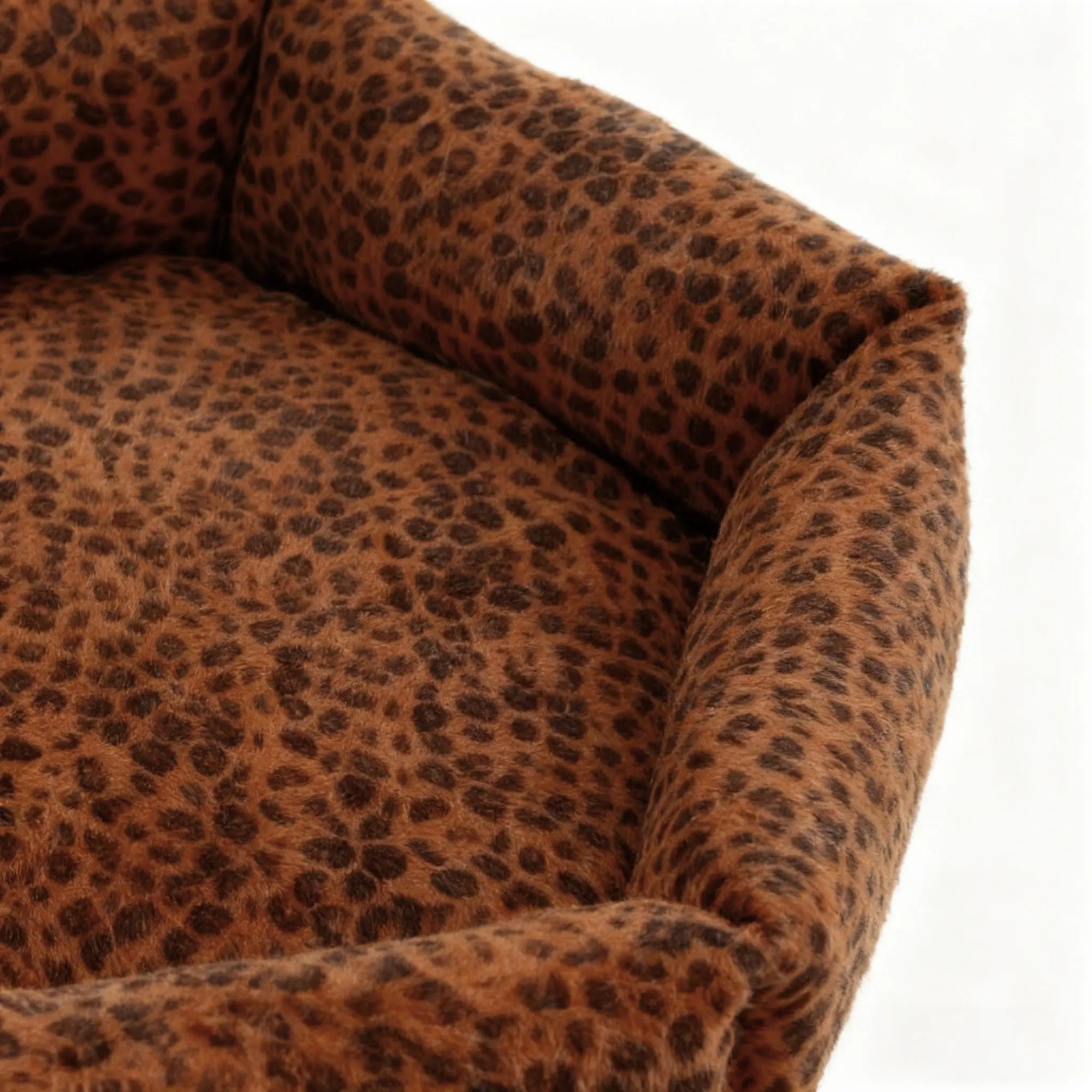 Close-up of a leopard print sofa armrest on a white background