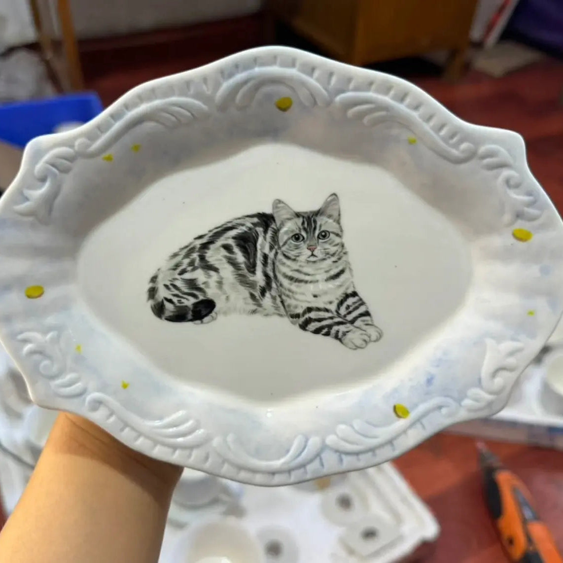 Artisan ceramic bowl featuring realistic custom pet photo artwork, personalized pottery gift