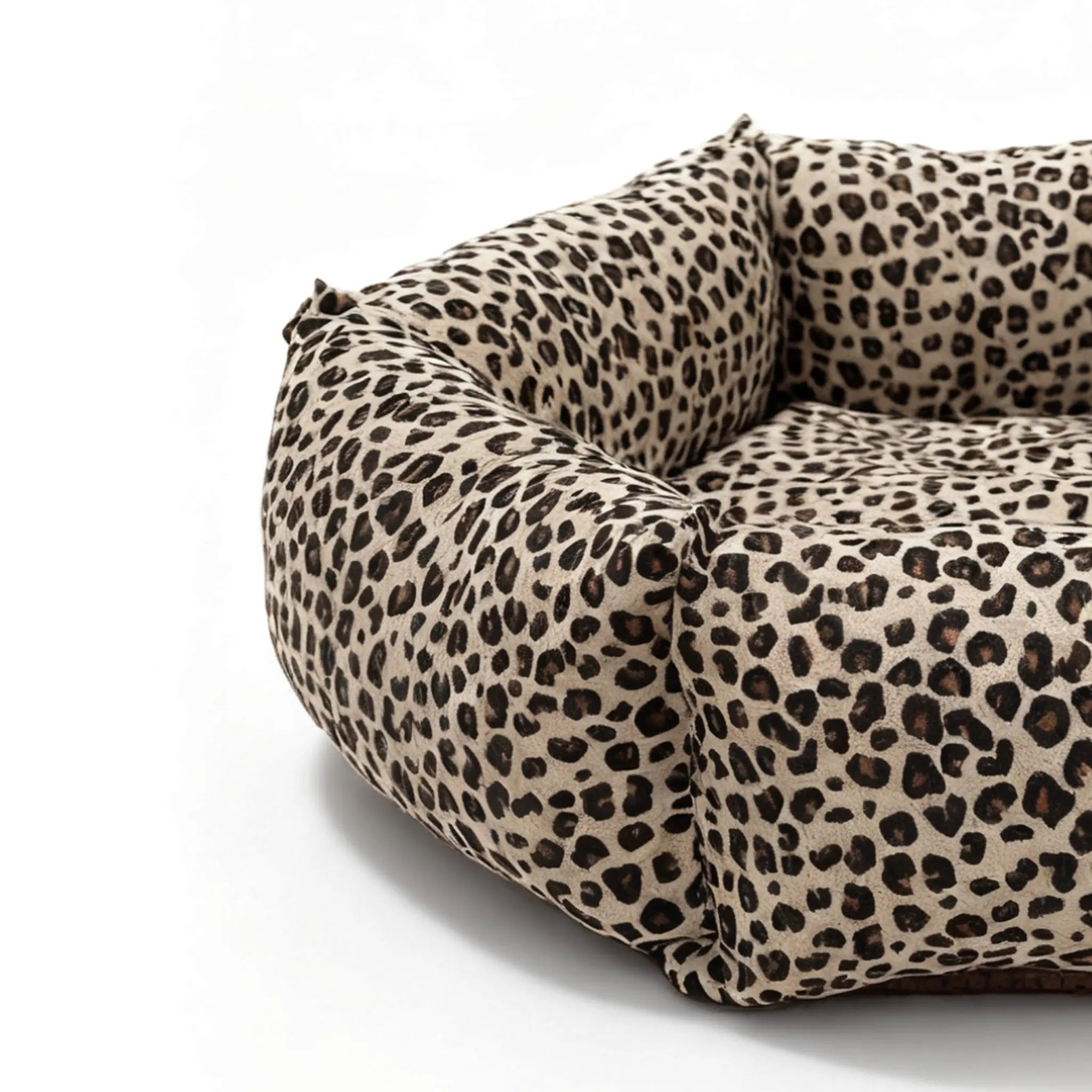 Leopard print pet bed on a white background