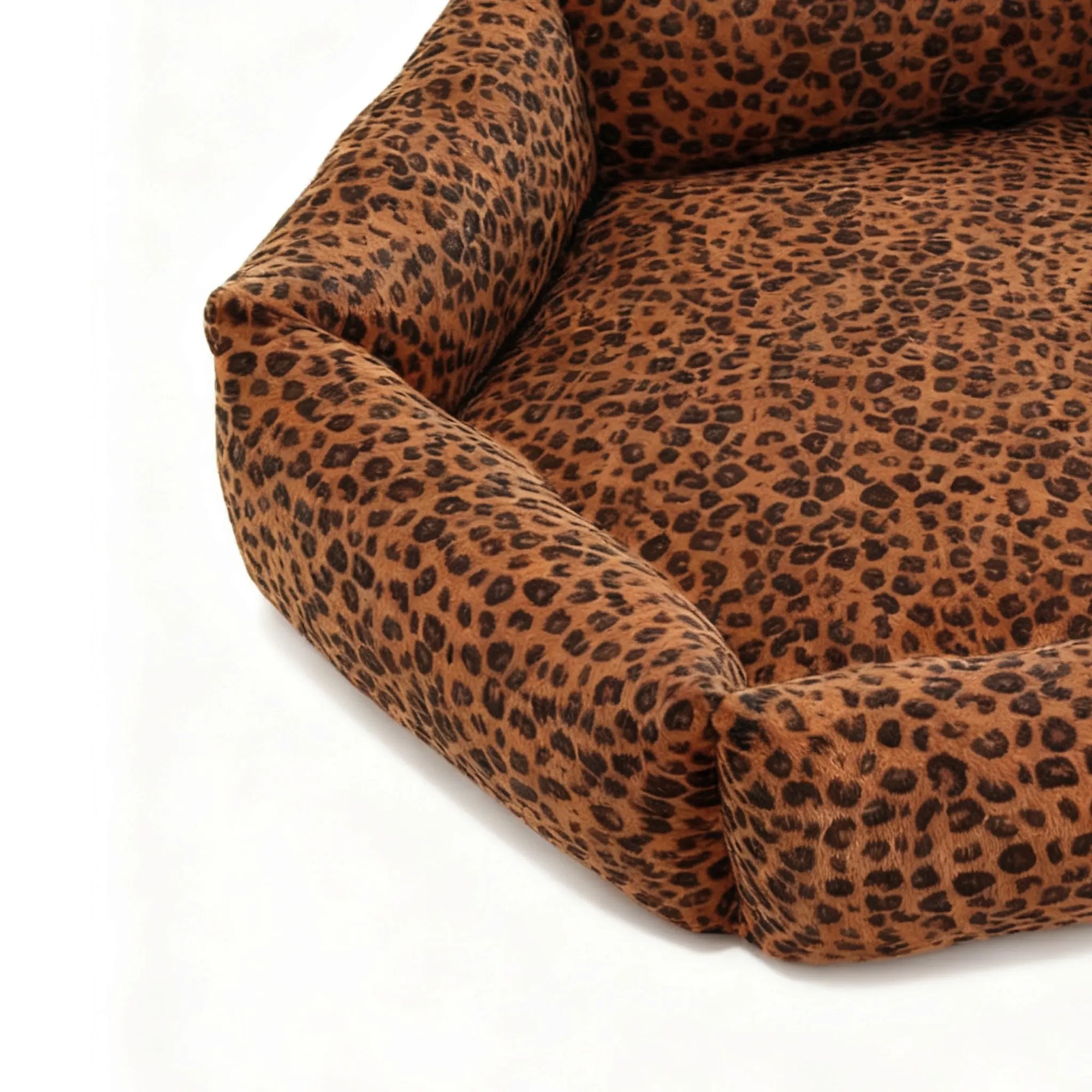 Leopard print pet bed on a white background