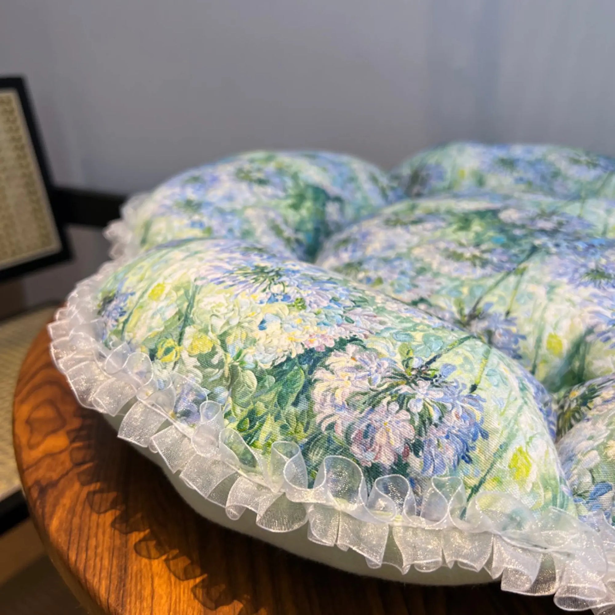 Close-up detail of the petal cat bed showing the durable canvas fabric and reinforced stitching for senior cat comfort. Fully machine washable.