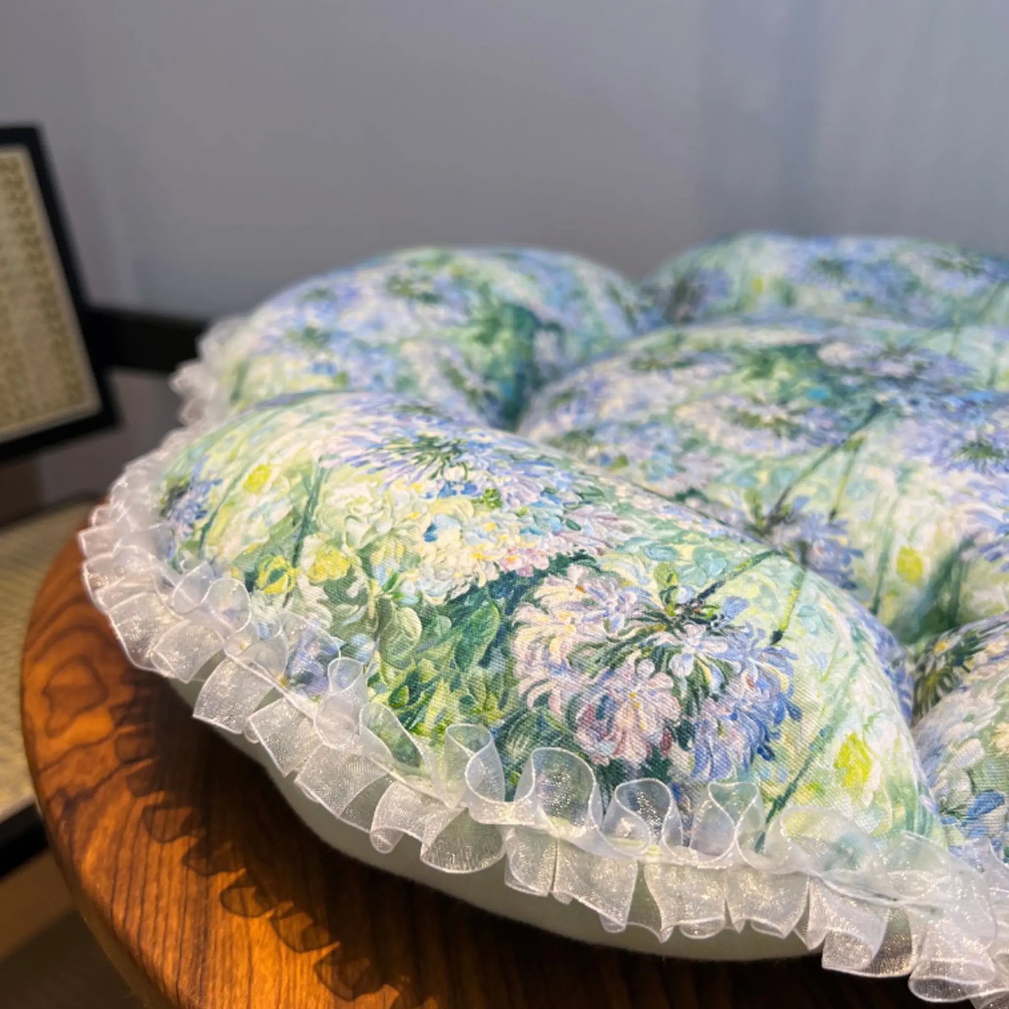 Close-up detail of the petal cat bed showing the durable canvas fabric and reinforced stitching for senior cat comfort. Fully machine washable.